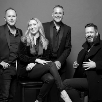 a group of people posing for a photo